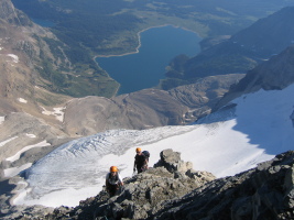 Caitlin and Hedd-wyn climbing with the spectacular glacier and Lake Magog
