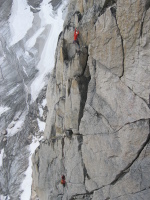 Climber leading the last pitch of Paddle Flake (5.10b), Crescent Spire