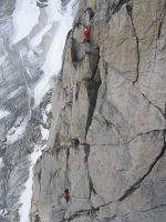 Climber leading the last pitch of Paddle Flake (5.10b), Crescent Spire