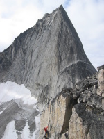 Climber topping out on Paddle Flake (5.10b), Crescent Spire