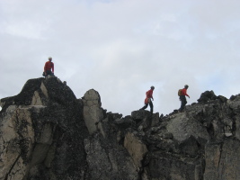 Climbers walking along the ridge of Crescent Spire