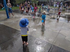 At the splash park on a hot day