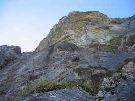 The large overhang feature at the top of the cliff (sustained 5.11a)