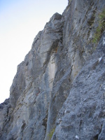 5.10a pitch variation by following this corner past two bolts (crux)
