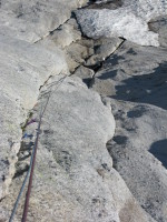 Parisa belaying at the base of the route