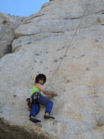 Toproping the 5.10d face to the left of Candyland