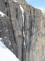 Top of Cryophobia, V M8 WI 5+: the ice is totally sunbaked and rotten, more of an early season climb