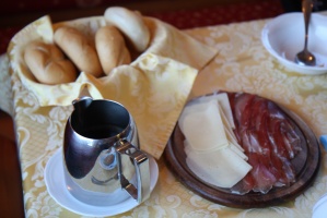 Breakfast essentials: bread, amazing coffee, and “speck and cheese”