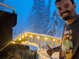 No power, no problem. BBQ'ing during the biggest storm of the season (3+ feet of snow). Little honda generator powering the lights :)