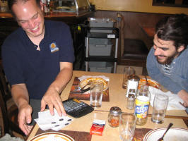 Henning calculating bills at the restaurant - he got handed a calculator, too