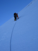John leading up steep snow
