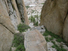 Scrambling down the gully. It cliffs out, and another short rappel is needed (bring some webbing to back up if needed).