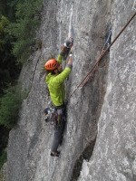 After the face traverse, the crux is a thin lieback/finger crack (11a)