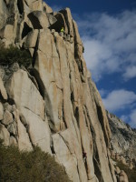 Pavel climbing with Karen belaying on top