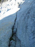 Looking down the first pitch (55 meters, 5.9) of Fairview Dome