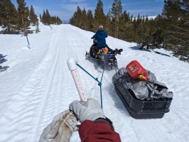 4 people, 1 snowmobile on the way out after dropping off the snowcat on top due to plowing :)
