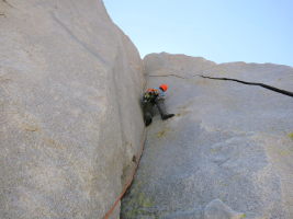 Starting the 2nd pitch of the West Face - it starts with an amazing hands splitter in a corner, and only gets better. Cocaine for climbers!