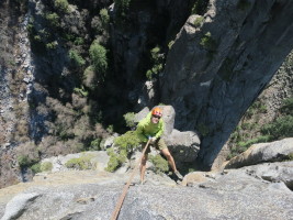 Beginning the scary overhanging rappel