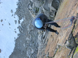 rappelling down the sheer face