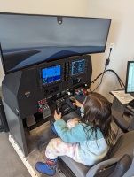 The kids got to fly the sim for a bit, too!
