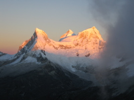 Huandoys at sunrise as seen from partway up Yanapaccha