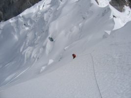 John climbing steep snow to join me near the summit of Yanapaccha