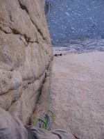 Pavel looking down from a temporary belay in the dihedral (we moved the belay a bit here)