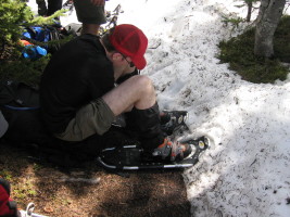 putting on snowshoes